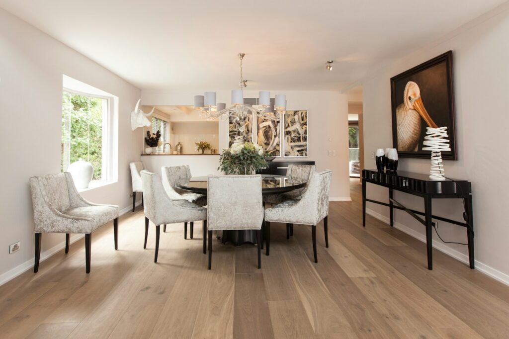 Designer dining room with timber flooring — photo by Claire Rendall