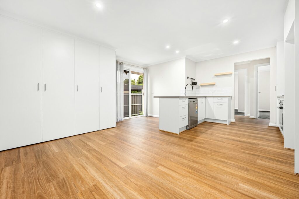 Empty contemporary living space with timber flooring — photo by Lisa Anna